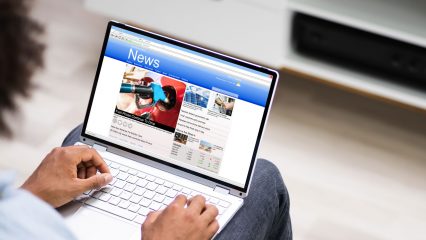 Picture of person reading a newsletter on a tablet