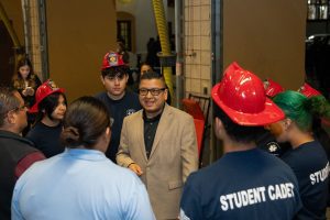 Jesse Armendarez talking to a group of junior fire fighters